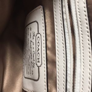 White striped and Tan Coach Pirse